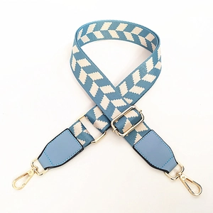 Adjustable blue and white geometric herringbone pattern bag strap with gold metal clips