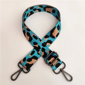 Detail of adjustable leopard print wide nylon strap with gunmetal swivel hooks