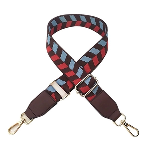 Adjustable woven wide bag strap with brown and red geometric pattern and gold hardware hooks