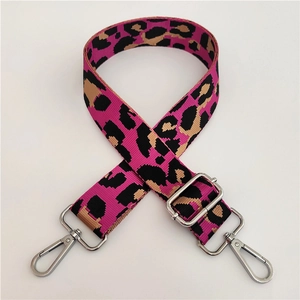 Adjustable nylon shoulder strap with vibrant pink leopard print and silver metal buckles