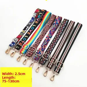 Detail of 2.5cm adjustable bag straps in various patterns with gold metal lobster clasps