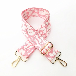 Detail of adjustable leopard print bag strap with durable gold metal swivel hooks