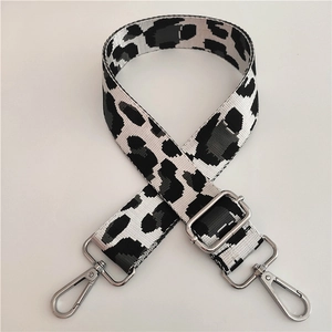 Adjustable nylon shoulder strap with black and white leopard pattern and silver metal hooks