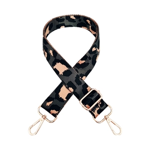 Close-up of adjustable nylon bag strap with grey leopard pattern and rose gold hardware