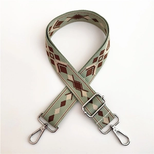 Close-up of bohemian geometric jacquard strap with silver metal lobster clasps