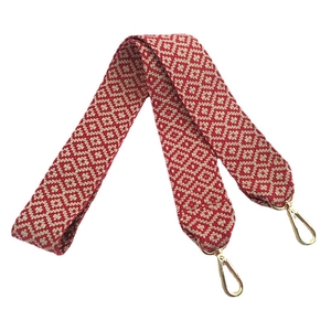 Ethnic style woven shoulder strap with red and beige geometric pattern and gold clips