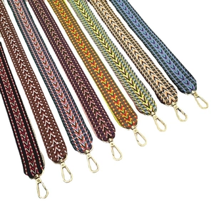 Ethnic embroidered bag straps with colorful geometric patterns and gold metal swivel hooks