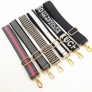 Detail of six adjustable replacement bag straps with golden metal hardware and patterns