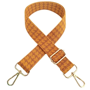 Adjustable wide houndstooth bag strap in yellow and brown with gold metal buckles