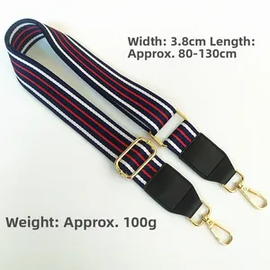 Detail view of adjustable 3.8cm wide striped strap with gold clips and 80-130cm length