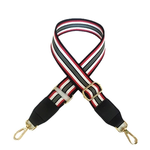 Adjustable wide striped canvas shoulder strap with red green stripes and gold hardware