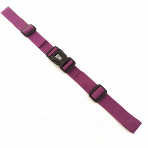 Close-up of adjustable purple nylon backpack chest strap with black quick-release buckle
