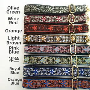 Detailed macro view of eight colorful bohemian jacquard purse straps with gold hardware