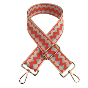 Adjustable colorful woven bag strap with geometric wave pattern and gold metal hooks