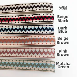 Detail of six colorful cotton woven guitar straps with ethnic zigzag patterns