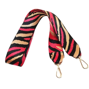 Adjustable zebra print nylon shoulder strap with light gold lobster clasps for bags