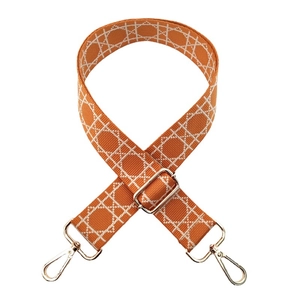 Adjustable orange jacquard wide shoulder strap with white geometric pattern and gold clips