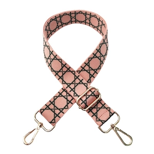 Adjustable pink and black geometric pattern wide shoulder strap with gold metal hooks