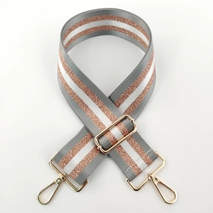 Detail of adjustable grey and white nylon strap with sparkling rose gold metallic thread