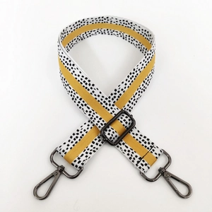 Detail of 3.8cm colorful wide shoulder strap with gunmetal hooks and yellow stripe