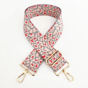 Adjustable wide leopard print bag strap with pink woven jacquard and gold metal hooks