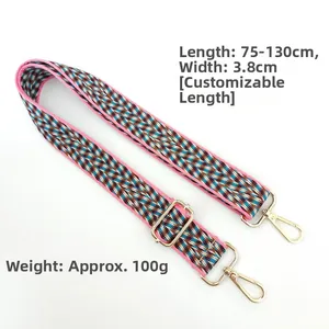 Close-up of colorful woven shoulder strap with geometric patterns and gold metal buckles