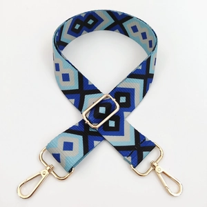 Detail of adjustable geometric ethnic style bag strap with gold metal lobster hooks