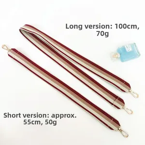 Detail of red and brown striped canvas bag straps with gold metal swivel hooks and sizes
