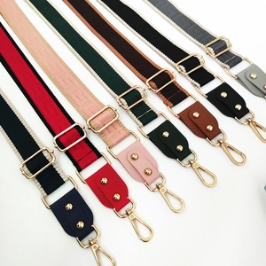 Detail of adjustable colorful wide woven canvas shoulder straps with meander patterns