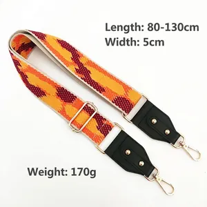 Bandoulière réglable de 5cm de large avec motif géométrique tissé et boucles dorées