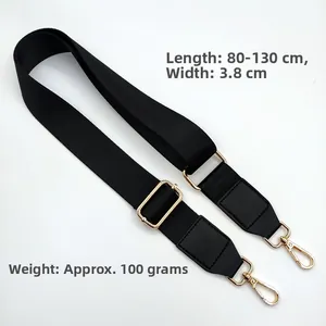Detail of adjustable black nylon shoulder strap with gold metal hooks, 80-130cm length