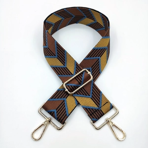 Adjustable geometric pattern wide shoulder strap with gold-tone hardware for handbags