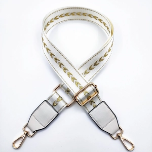 White nylon shoulder strap with gold arrow embroidery and adjustable metal lobster hooks