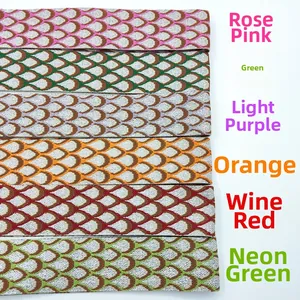 Detail of adjustable peacock pattern bag straps showing woven texture in multiple colors