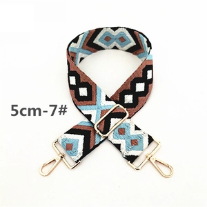Detail of 5cm wide adjustable ethnic style canvas strap with gold metal hooks