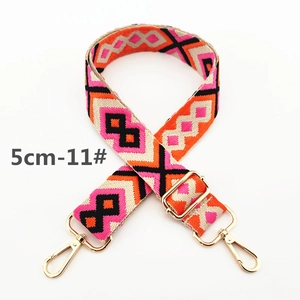 Close-up of 5cm wide bohemian geometric pattern canvas strap with gold metal hooks