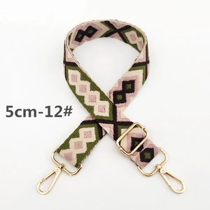 Detail of 5cm wide bohemian geometric pattern woven strap with gold metal hooks