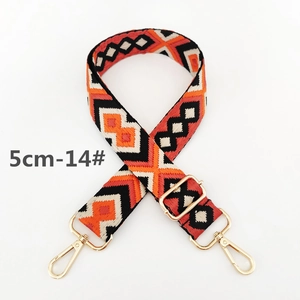 Detail view of 5cm wide ethnic geometric pattern woven strap with gold metal hooks