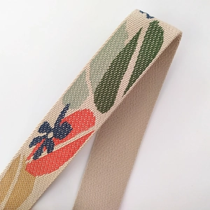 Floral embroidered canvas bag strap with colorful jacquard pattern on beige base
