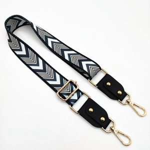 Adjustable chevron patterned bag strap with gold studs and lobster clasps