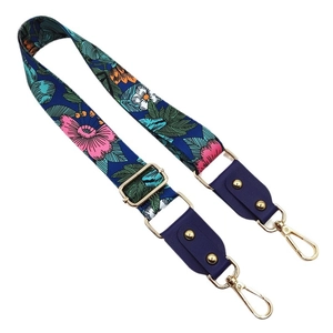 Adjustable dark blue floral shoulder strap with gold-tone lobster clasps for handbags