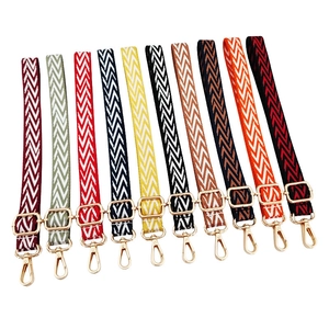 Adjustable woven shoulder strap with herringbone pattern and gold metal buckles for bags