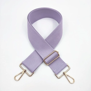 Detail view of lilac purple adjustable wide strap with golden lobster clasps for handbags