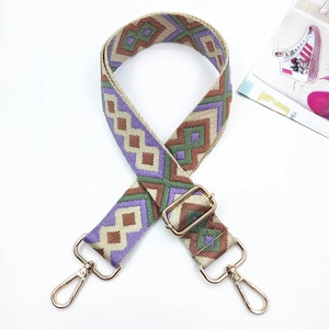Ethnic geometric embroidery replacement bag strap with gold metal buckles on white background