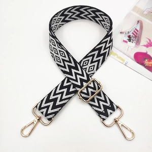Adjustable wide replacement bag strap with black and white geometric embroidery and gold hooks