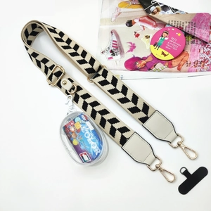 Close-up of adjustable phone strap with geometric patterns and transparent coin pouch