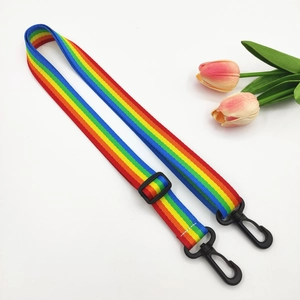 Adjustable rainbow striped shoulder strap with black plastic buckles and swivel hooks