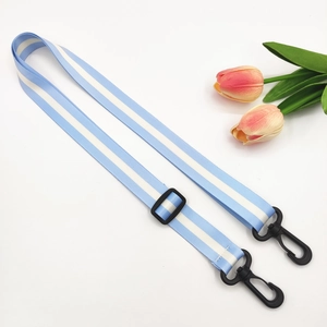 Detail of adjustable light blue striped strap with durable black plastic rotating hooks