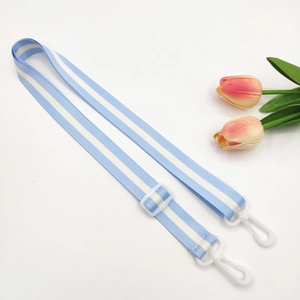 Detail view of adjustable blue and white striped strap with white plastic swivel hooks