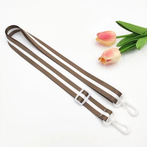 Detail of adjustable 2.5cm brown and white striped strap with durable plastic buckles